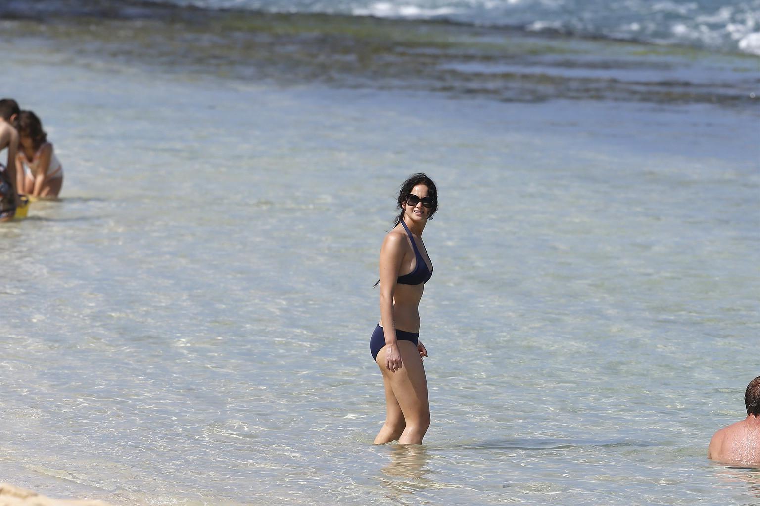 10P Jennifer Lawrence wearing skimpy dark blue bikini at a beach in Hawaii