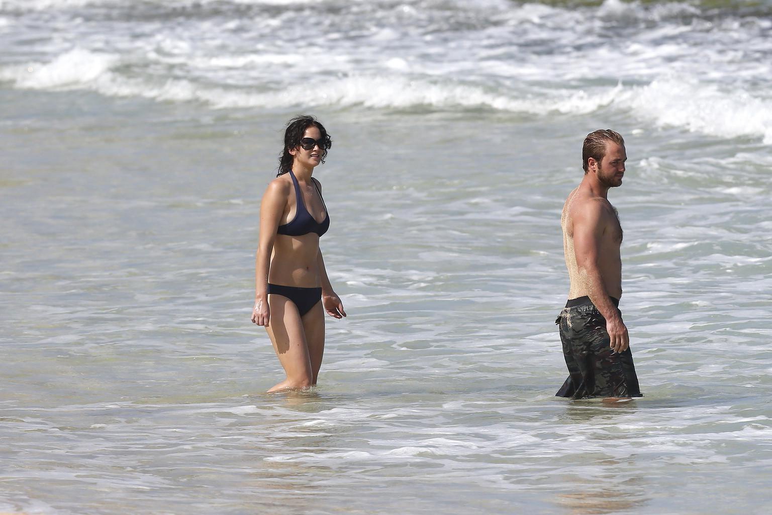 10P Jennifer Lawrence wearing skimpy dark blue bikini at a beach in Hawaii