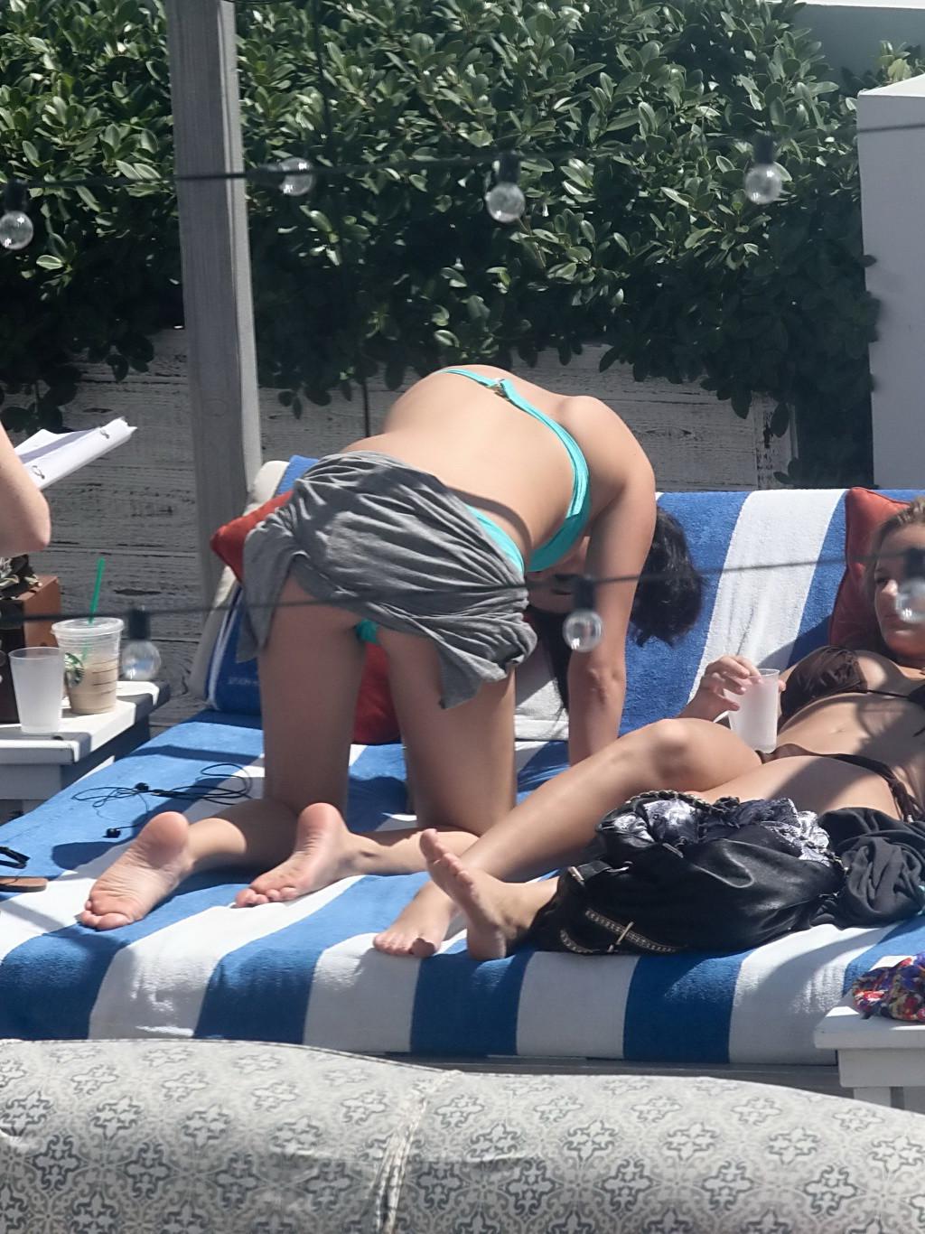 10P Selena Gomez showing cameltoe and big boobs in light blue tube bikini at a pool 