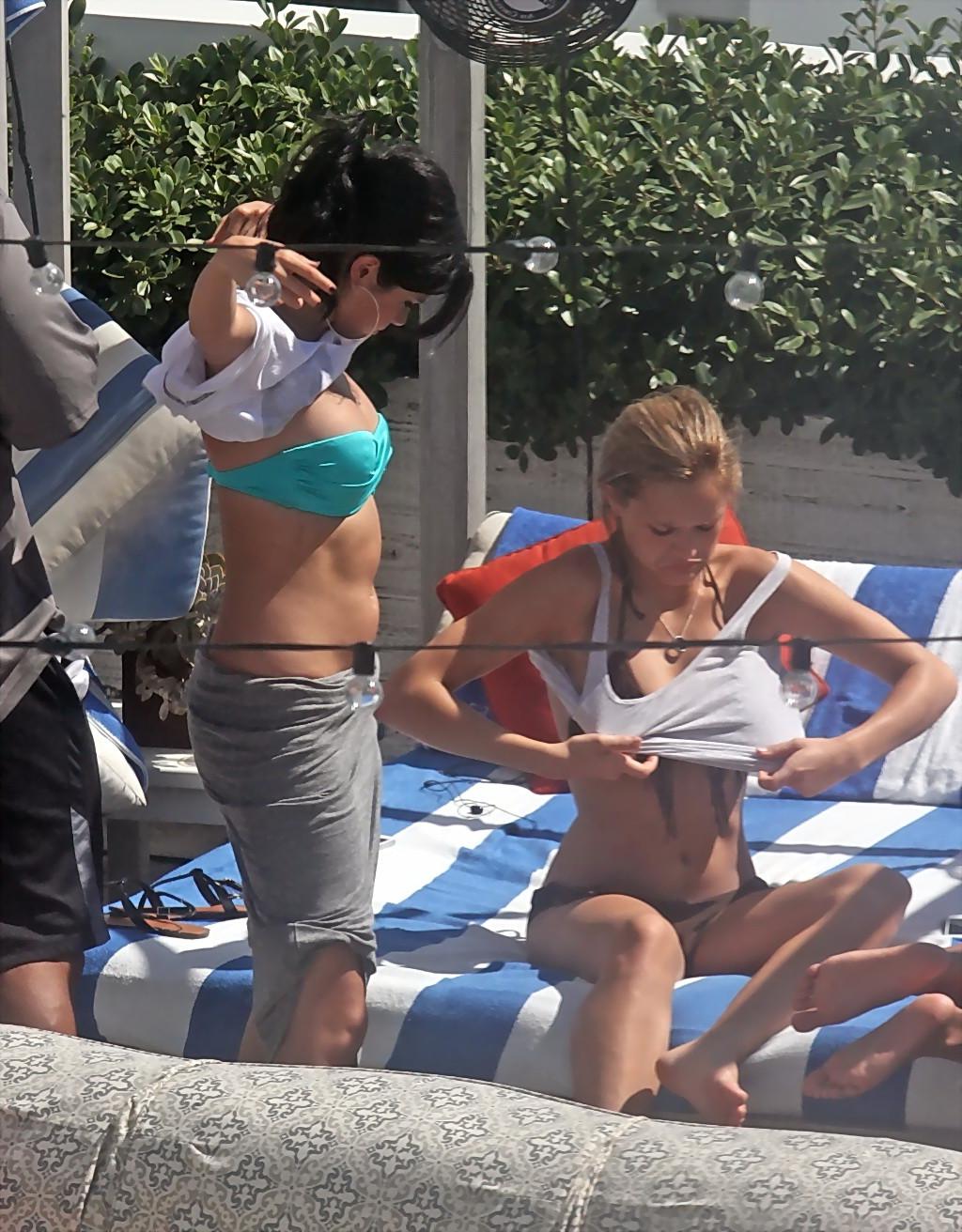 10P Selena Gomez showing cameltoe and big boobs in light blue tube bikini at a pool 