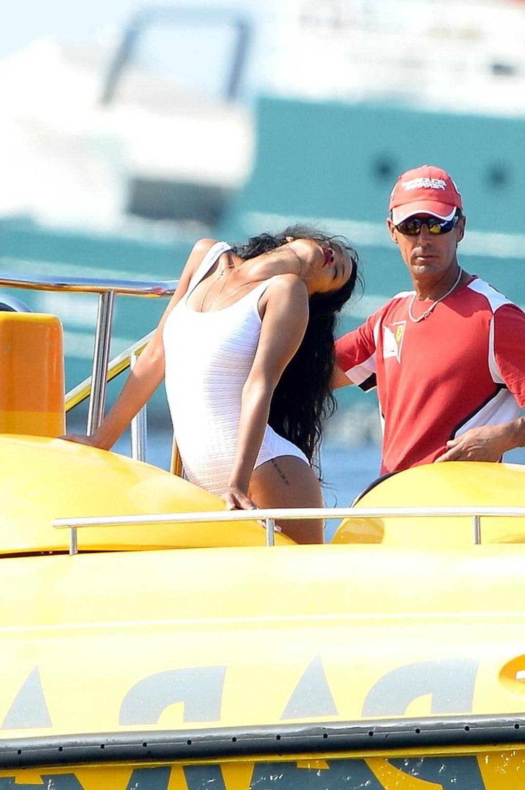 11P Rihanna in sexy white swimsuit posing on a boat in Cannes