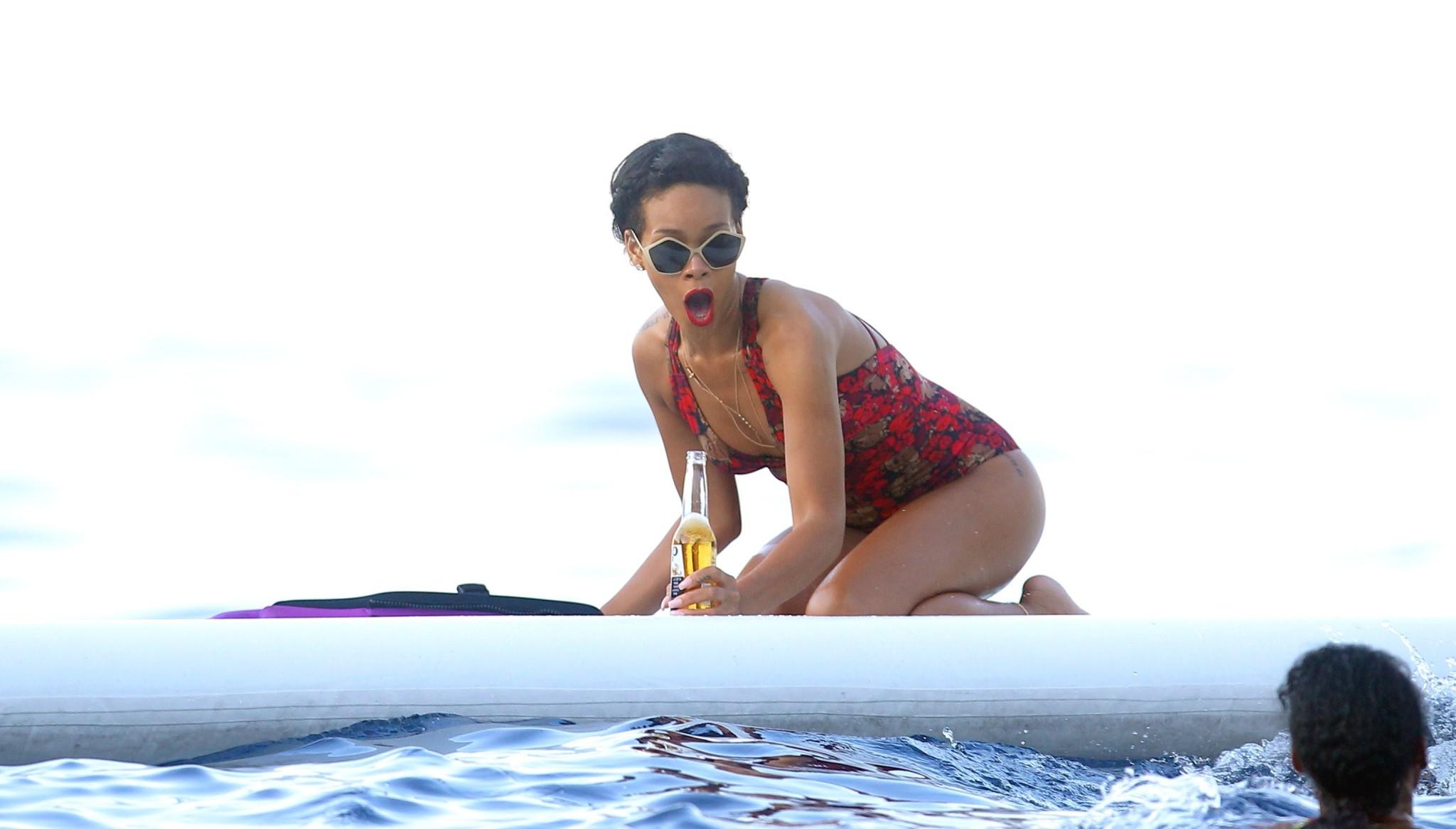10P Rihanna showing off her ass in sexy red swimsuit on a yacht in France