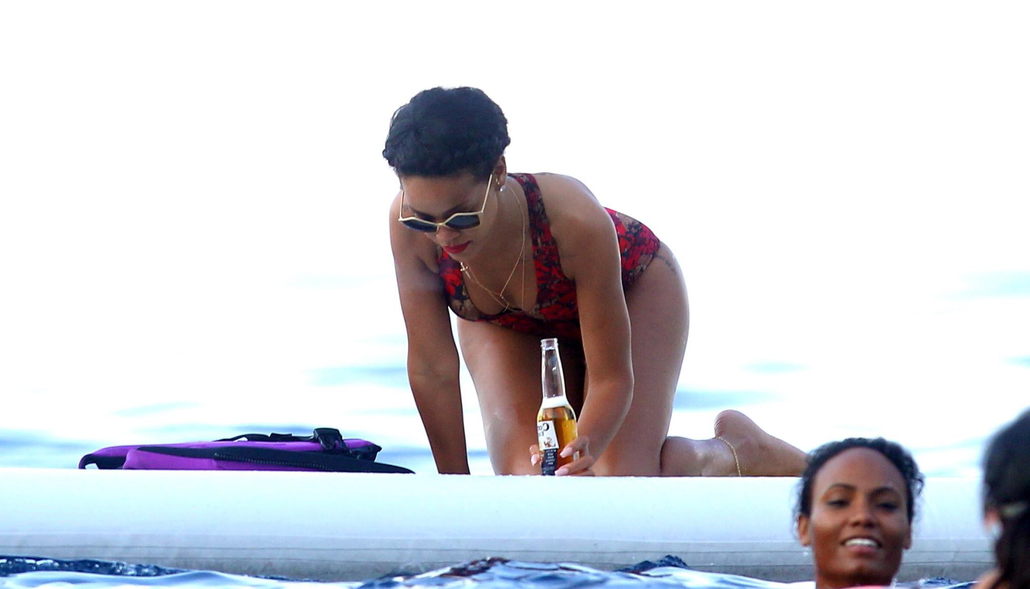 10P Rihanna showing off her ass in sexy red swimsuit on a yacht in France