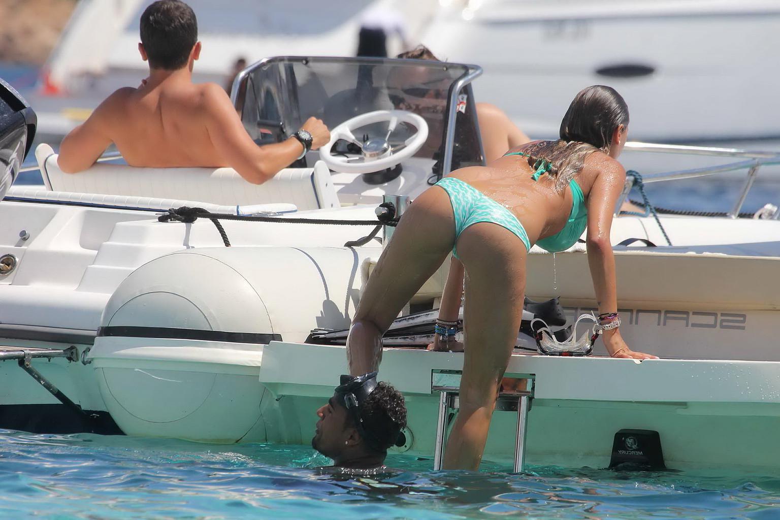 11P Gorgeous Melissa Satta wearing green thong bikini at the boat in Sardinia