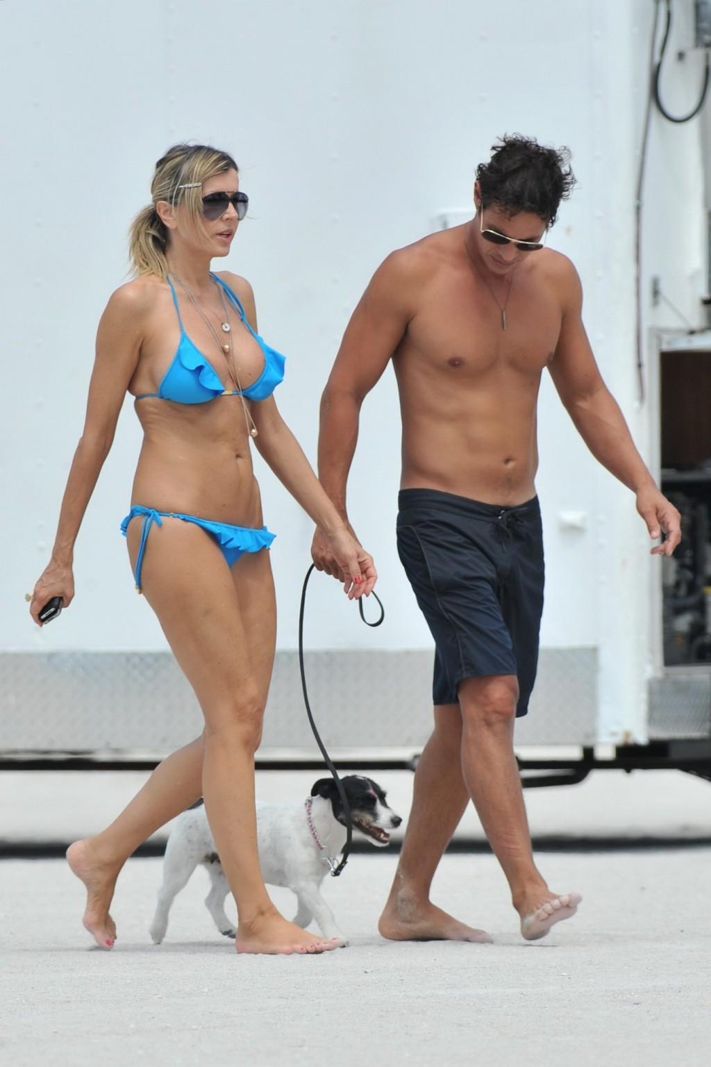 16P Rita Rusic busty wearing a sexy blue bikini on a beach in Miami