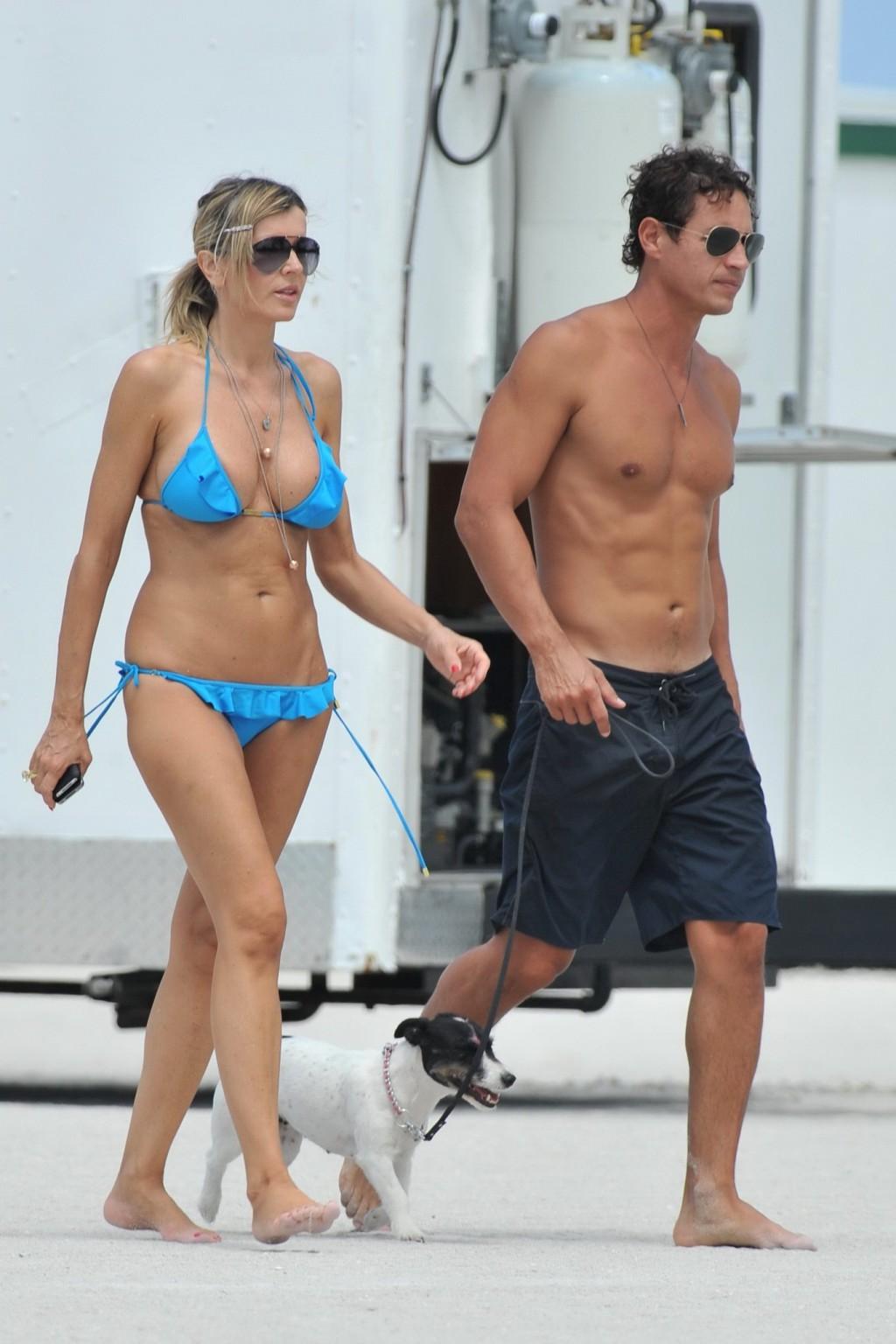 16P Rita Rusic busty wearing a sexy blue bikini on a beach in Miami