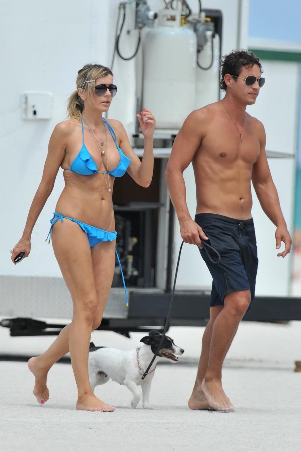 16P Rita Rusic busty wearing a sexy blue bikini on a beach in Miami