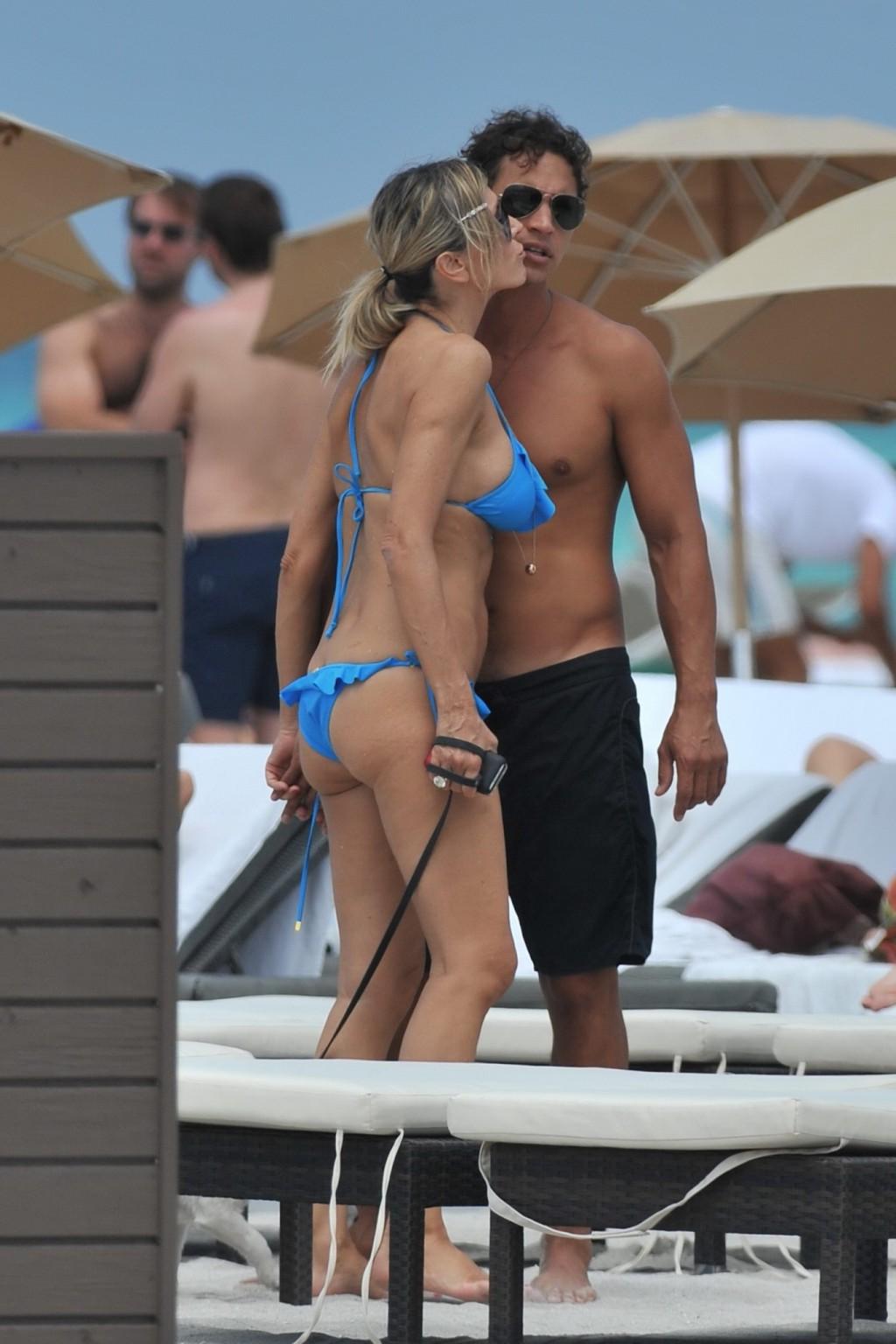 16P Rita Rusic busty wearing a sexy blue bikini on a beach in Miami