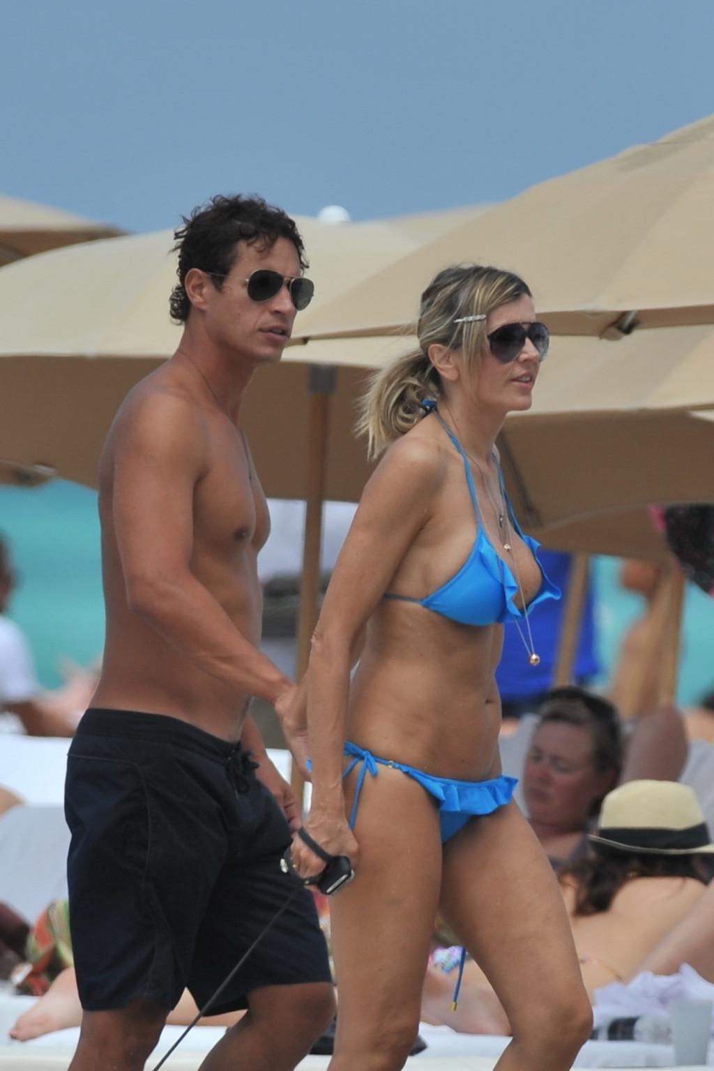 16P Rita Rusic busty wearing a sexy blue bikini on a beach in Miami