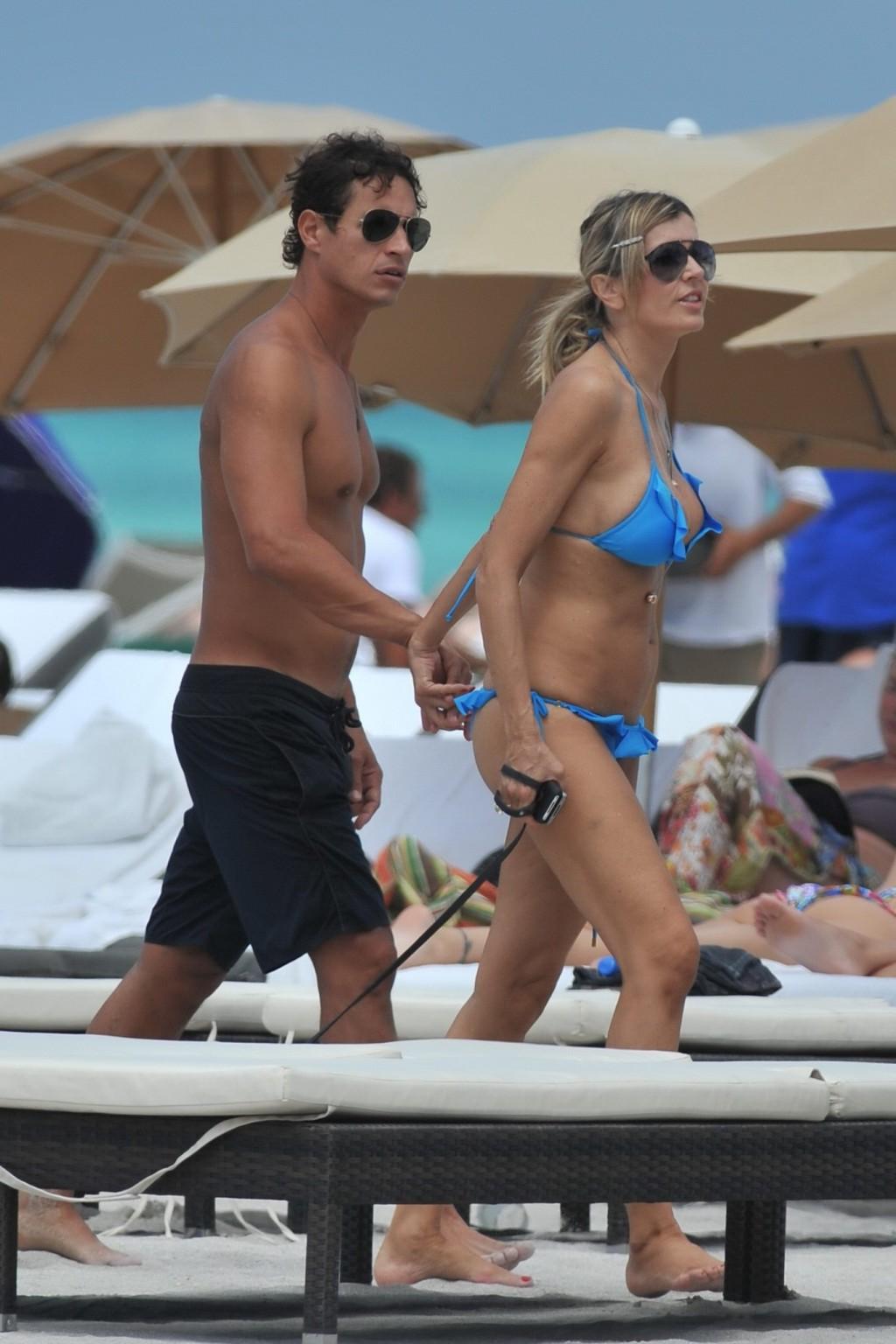 16P Rita Rusic busty wearing a sexy blue bikini on a beach in Miami