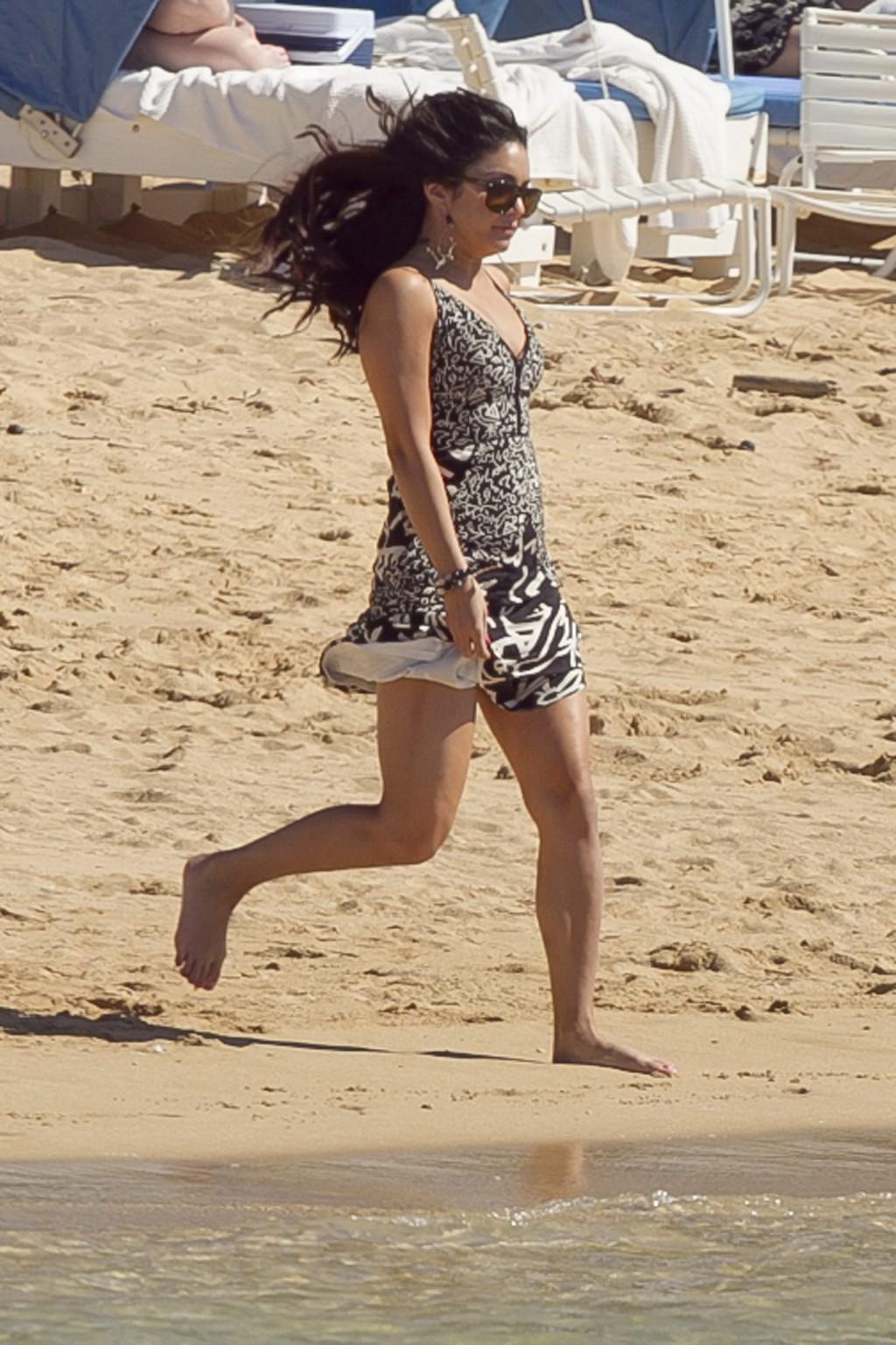 16P Vanessa Hudgens leggy pulling her dress up on a Hawaiian beach