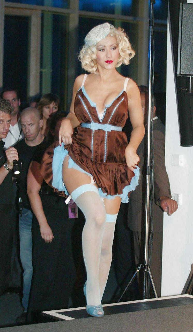 16P Christina Aguilera show huge cleavage and in mini skirt and blue stockings