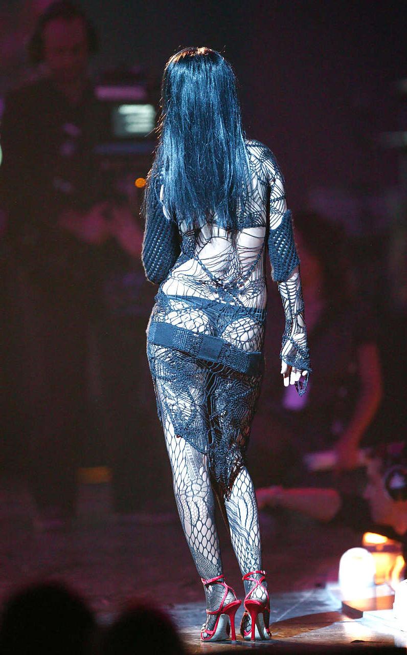 16P Christina Aguilera show huge cleavage and in mini skirt and blue stockings