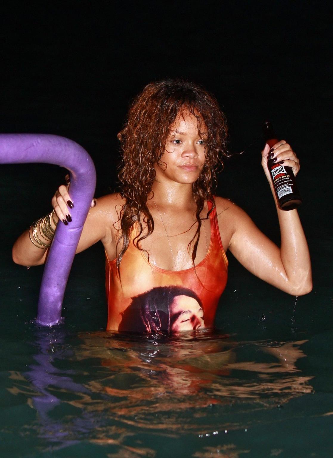 16P Rihanna in sexy swimsuit going for a dusk swim in Barbados