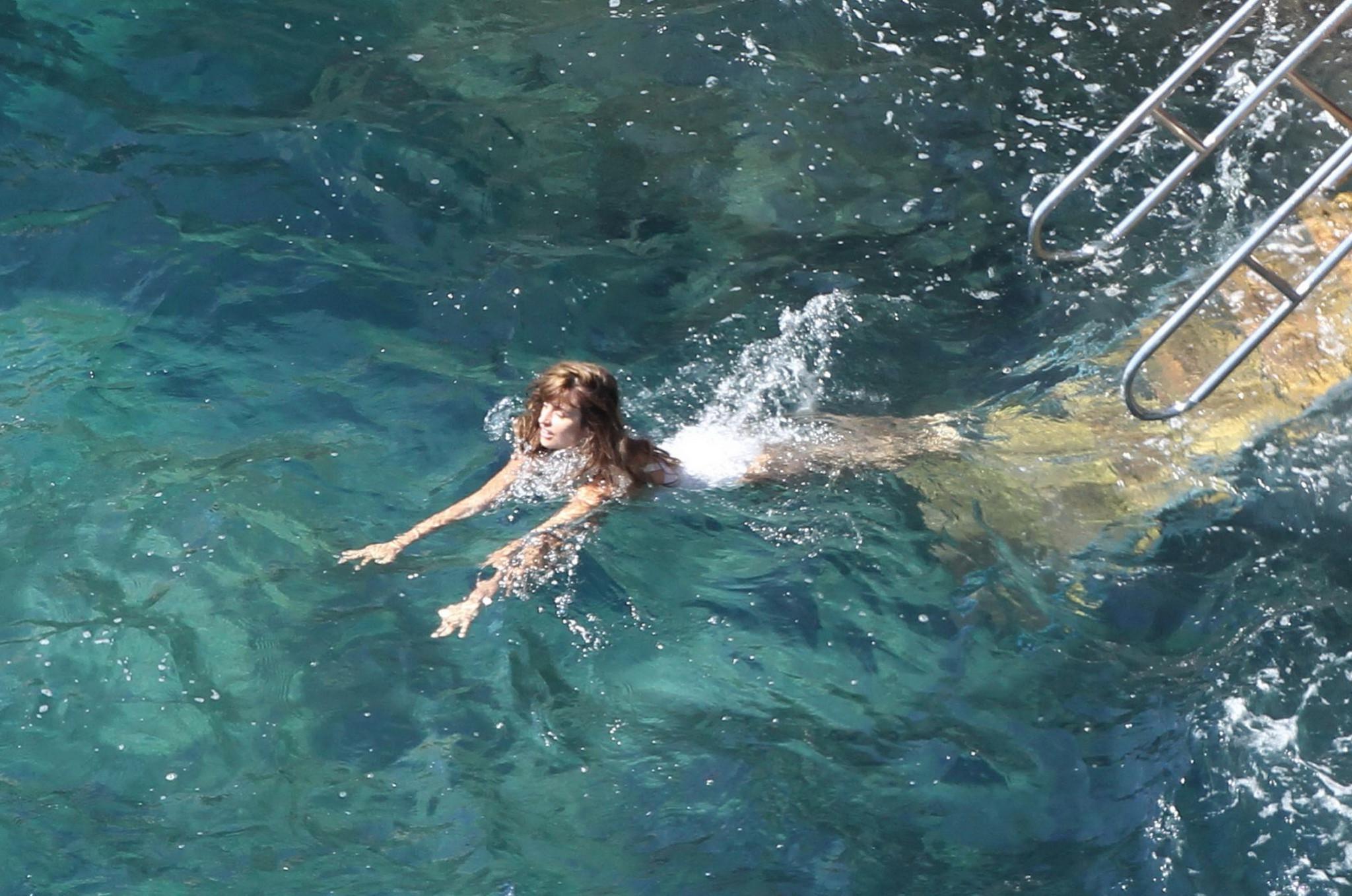 16P Penelope Cruz shows off her curvy body wearing sexy white swimsuit