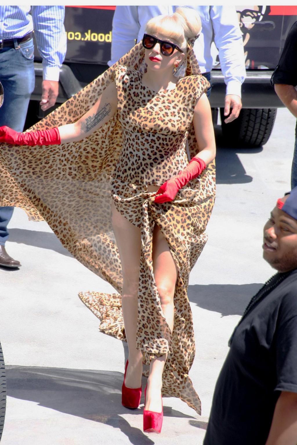 16P Lady Gaga shows side-boob wearing sexy blue outfit outside Amp Radio in LA
