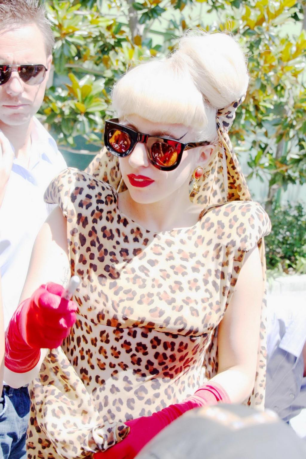 16P Lady Gaga shows side-boob wearing sexy blue outfit outside Amp Radio in LA
