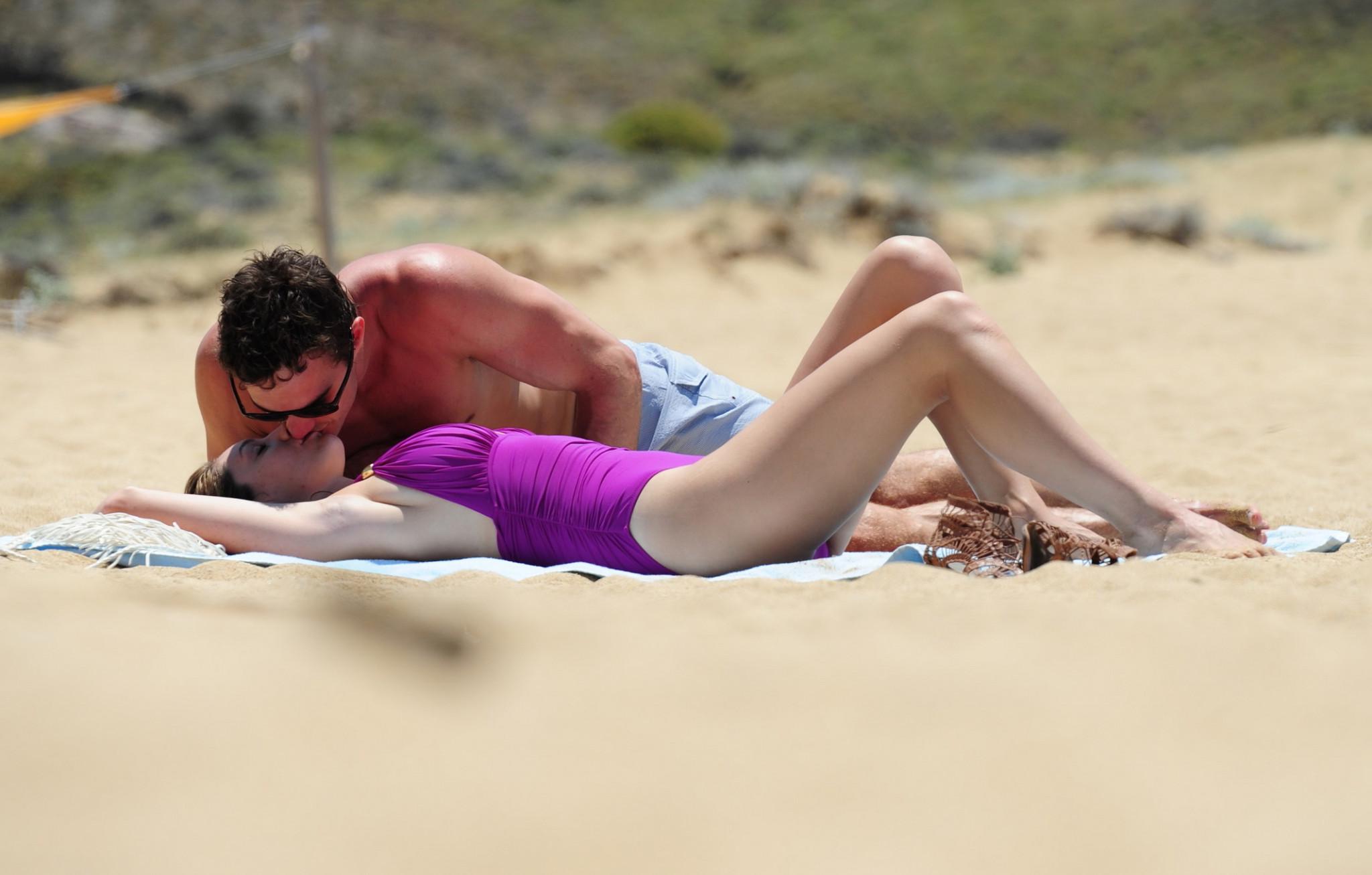 16P Busty Kelly Brook shows pokies wearing skimpy purple swimsuit
