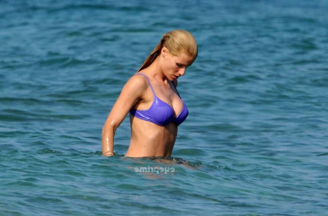 16P Michelle Hunziker looking very sexy in blue bikini on beach paparazzi pictures