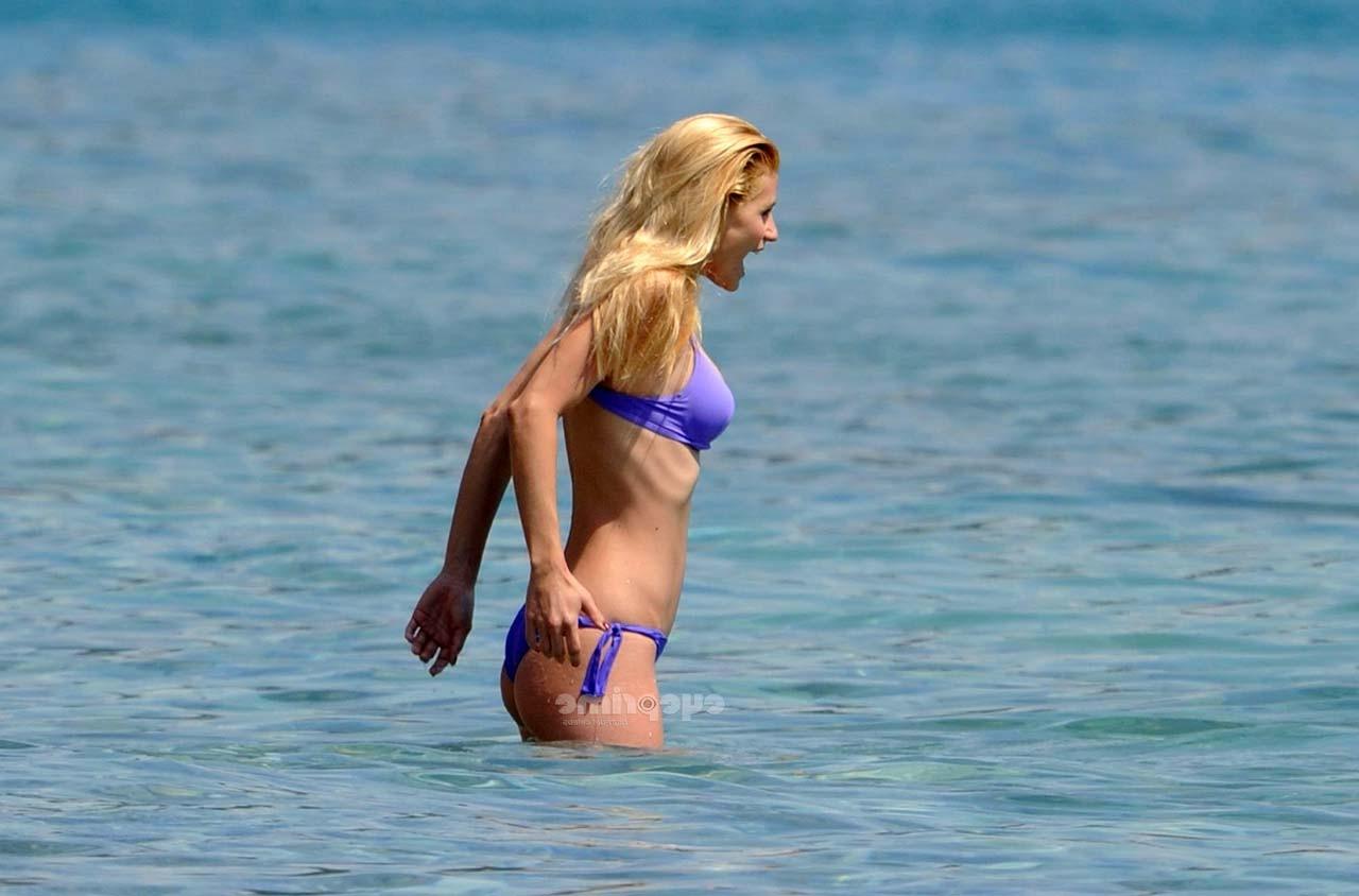 16P Michelle Hunziker looking very sexy in blue bikini on beach paparazzi pictures