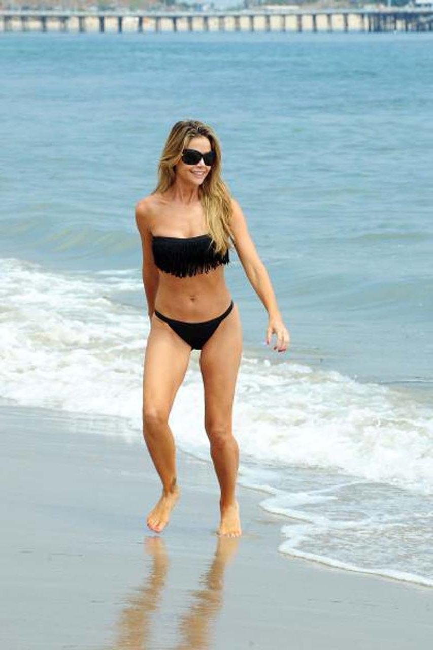 16P Denise Richards looking very sexy in blue bikini and topless on beach paparazzi 