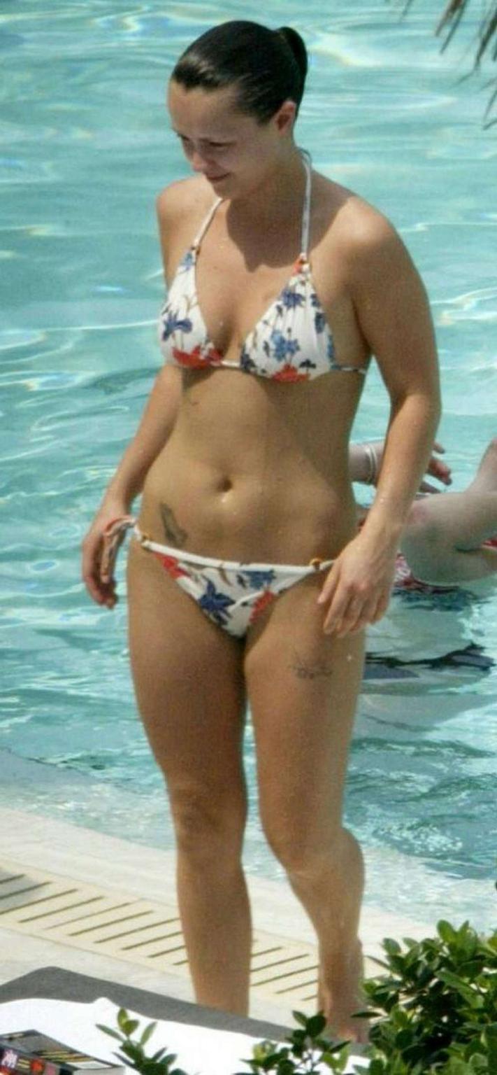 16P Christina Ricci looking very drunk in bikini with a beer in a hand