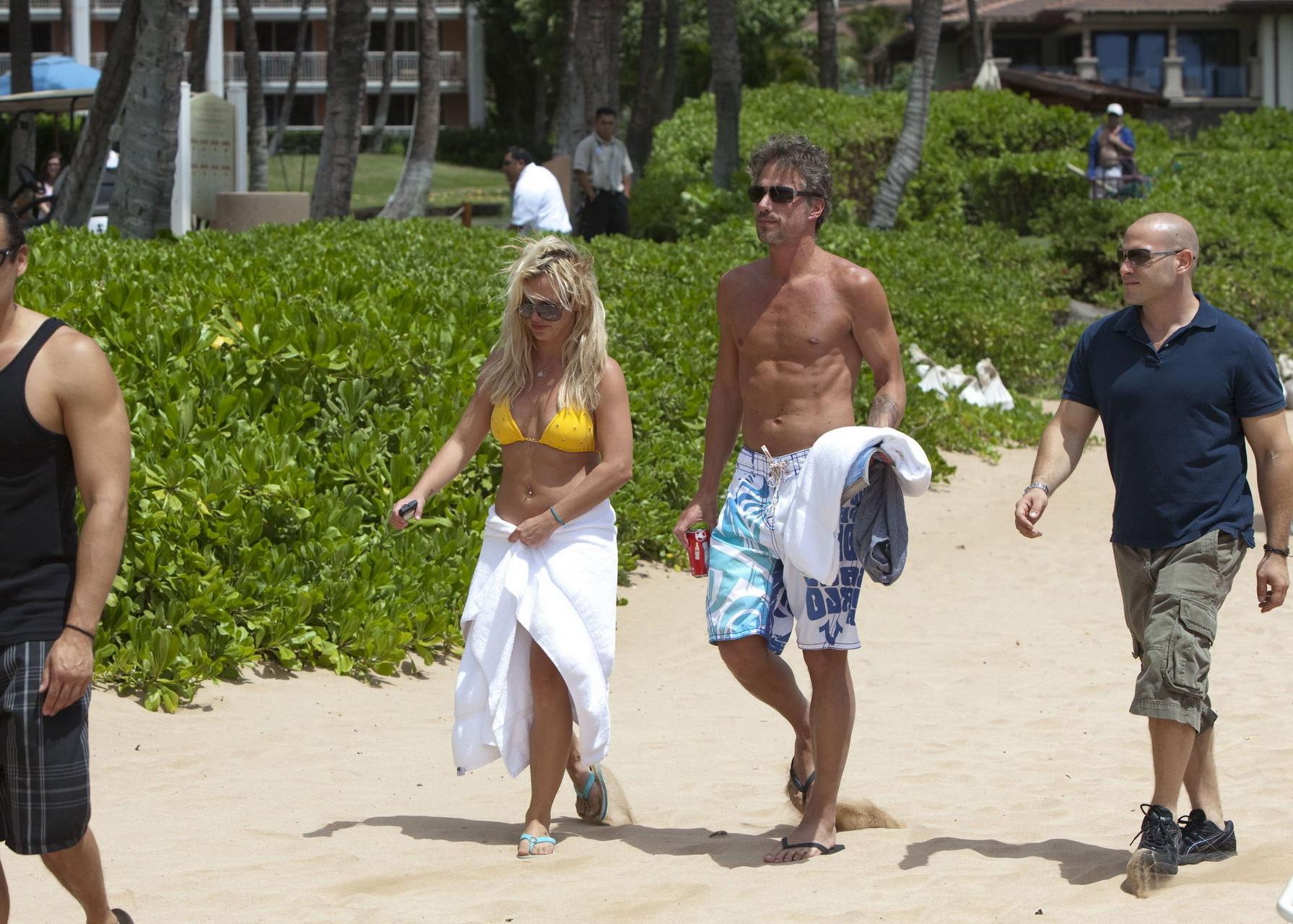 15P Britney Spears wearing sexy yellow bikini on Hawaiian beach
