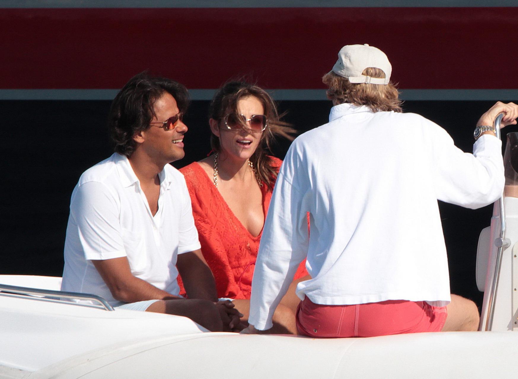 16P Elizabeth Hurley busty  ass shots wearing swimsuit on Valentino's yacht in Ibiza