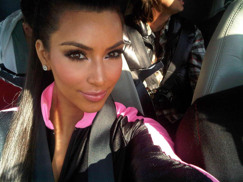 10P Kim Kardashian showing her body in onepiece suit and her great ass