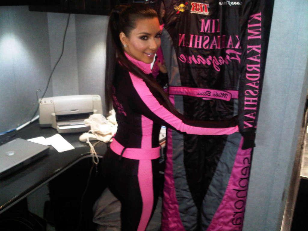 10P Kim Kardashian showing her body in onepiece suit and her great ass