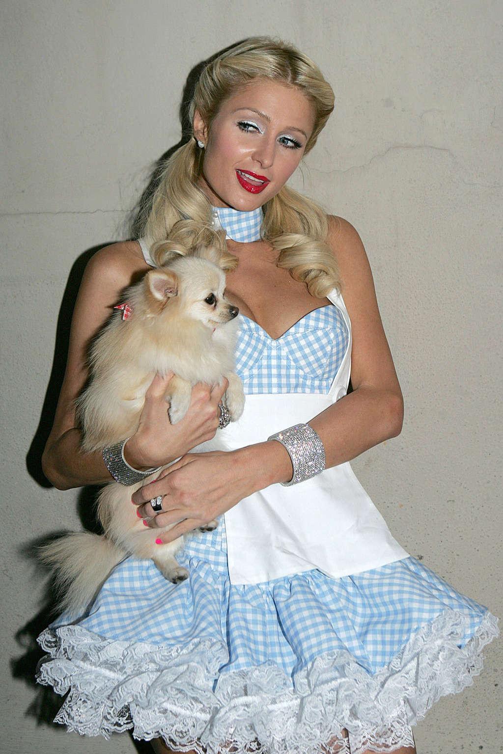 16P Paris Hilton looking hot in helloween costume and show tits and pussy