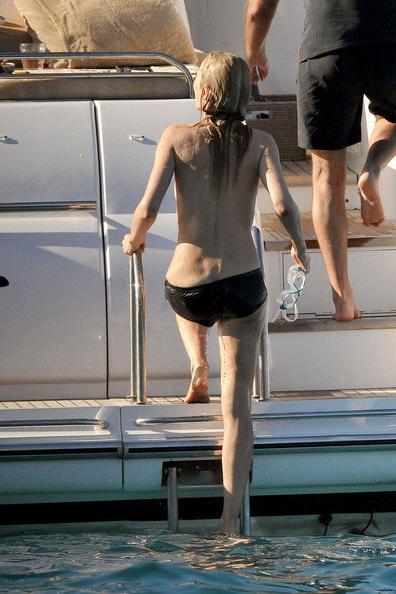 15P Kate Moss showing great topless on a boat