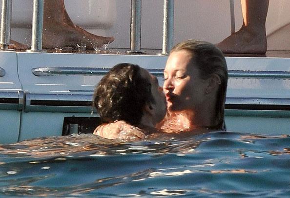 15P Kate Moss showing great topless on a boat