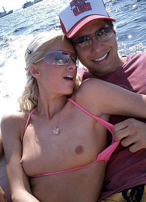 15P Paris Hilton showing her great tits in see thru top and on boat
