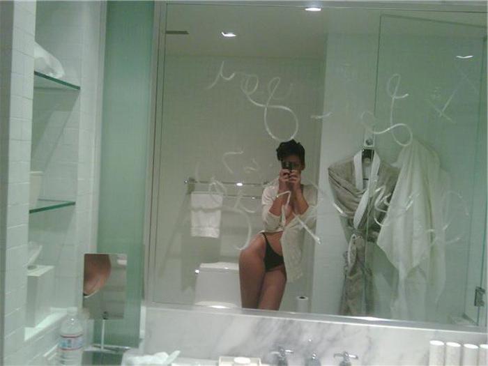 15P Rihanna shows her perky cleavage and naughty body