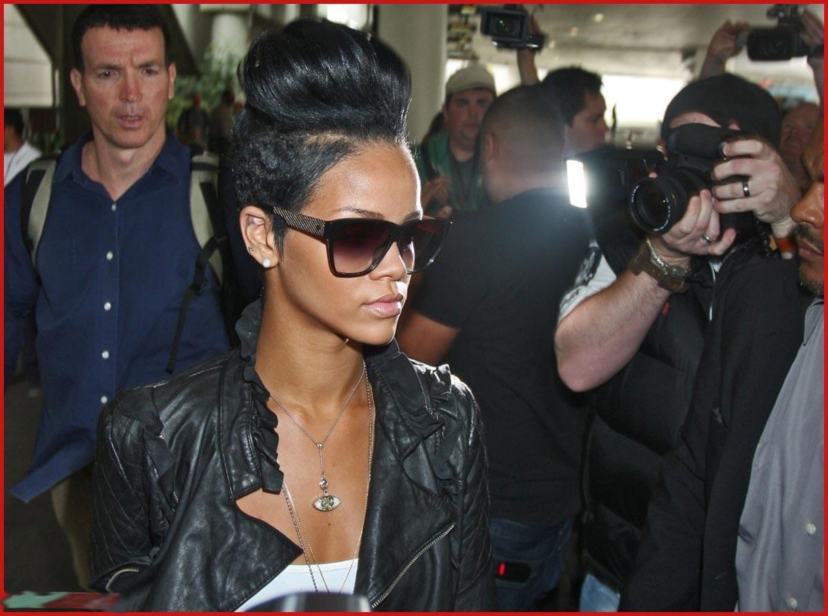 15P Rihanna shows her perky cleavage and naughty body