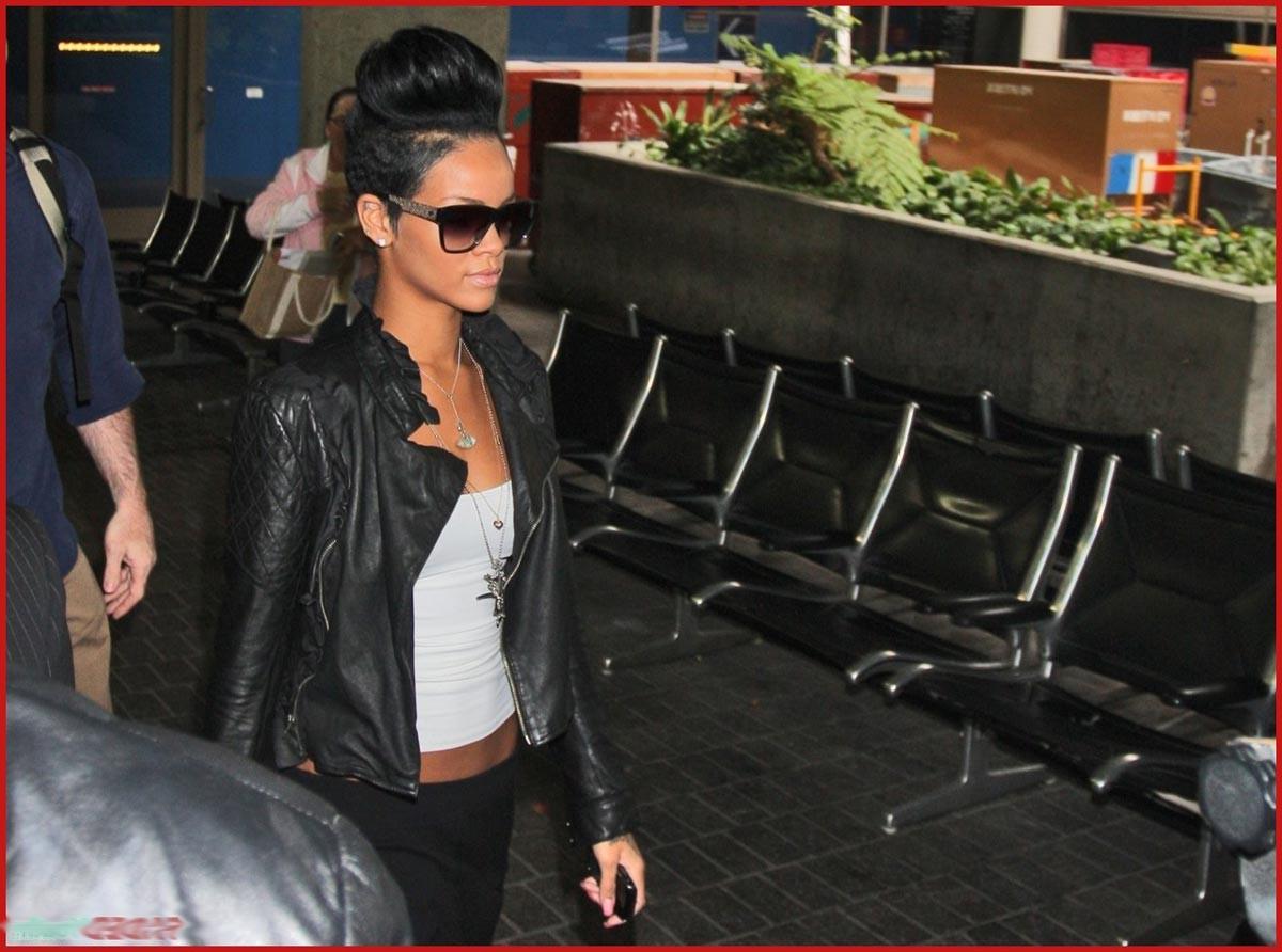 15P Rihanna shows her perky cleavage and naughty body