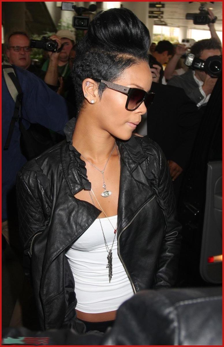 15P Rihanna shows her perky cleavage and naughty body