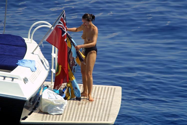 16P Carole Bouquet showing her nice big tits on boat