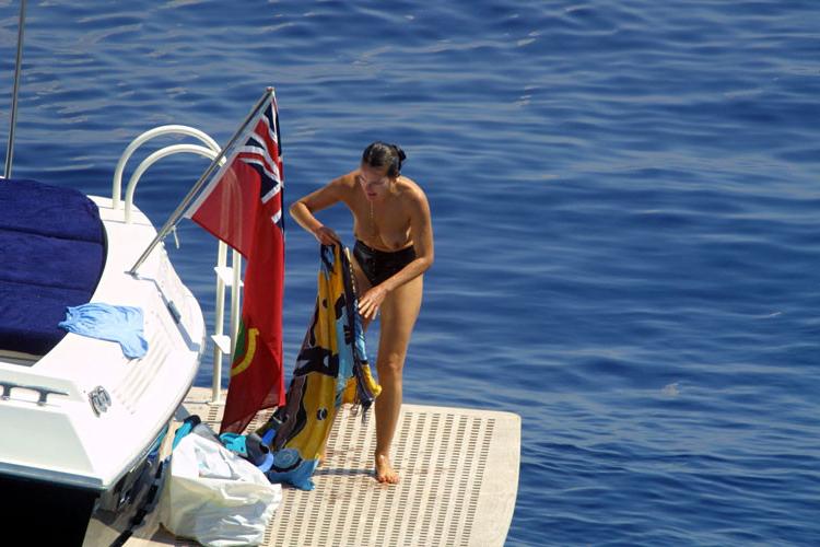 16P Carole Bouquet showing her nice big tits on boat