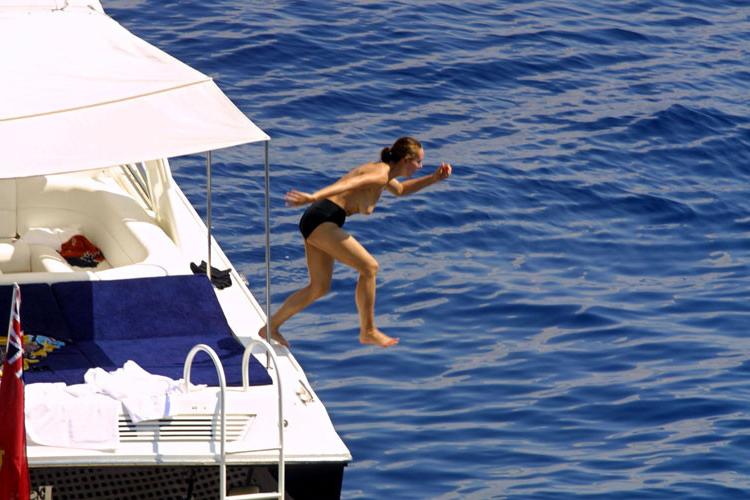 16P Carole Bouquet showing her nice big tits on boat
