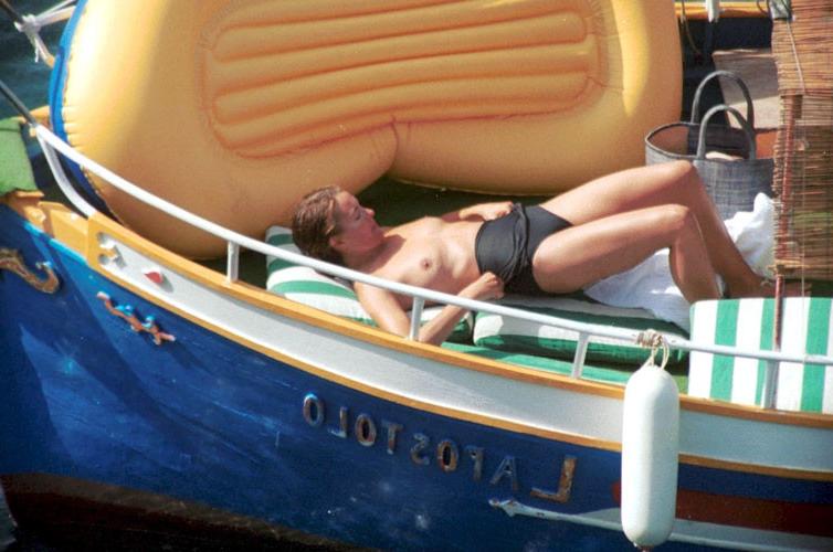 16P Carole Bouquet showing her nice big tits on boat