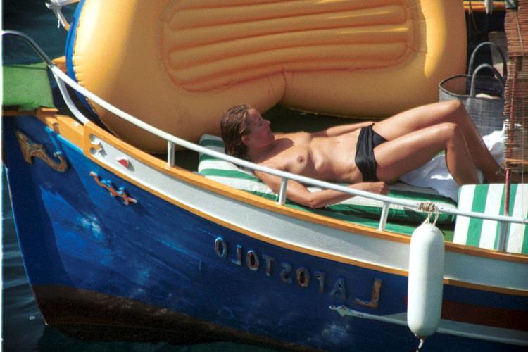 16P Carole Bouquet showing her nice big tits on boat