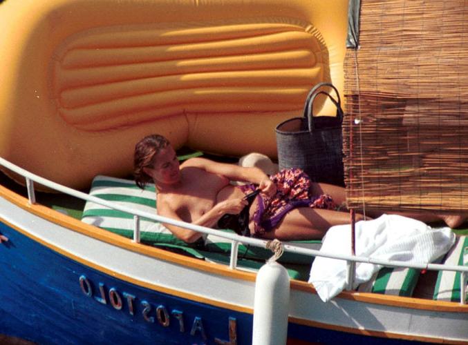16P Carole Bouquet showing her nice big tits on boat