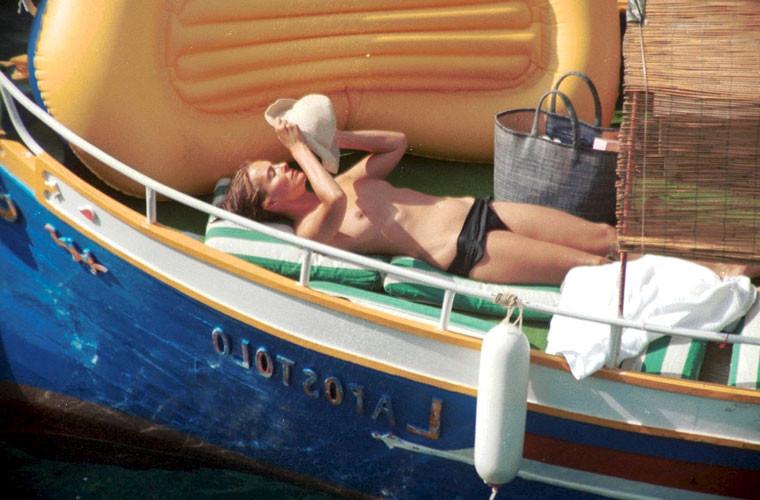 16P Carole Bouquet showing her nice big tits on boat