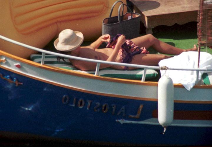 16P Carole Bouquet showing her nice big tits on boat