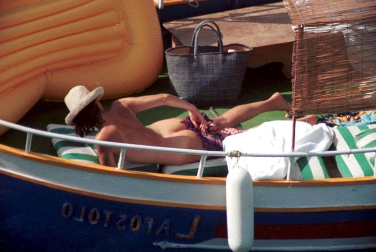 16P Carole Bouquet showing her nice big tits on boat