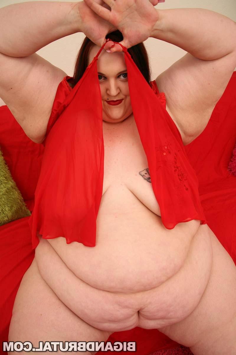 16P A BBW redhead playing with some huge dildos