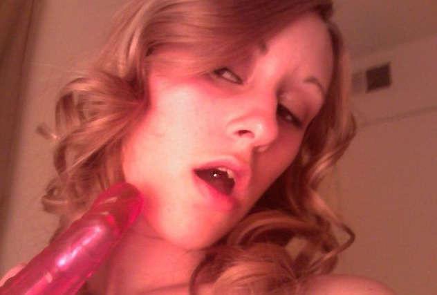 16P Pictures of a horny babe masturbating with her red dildo