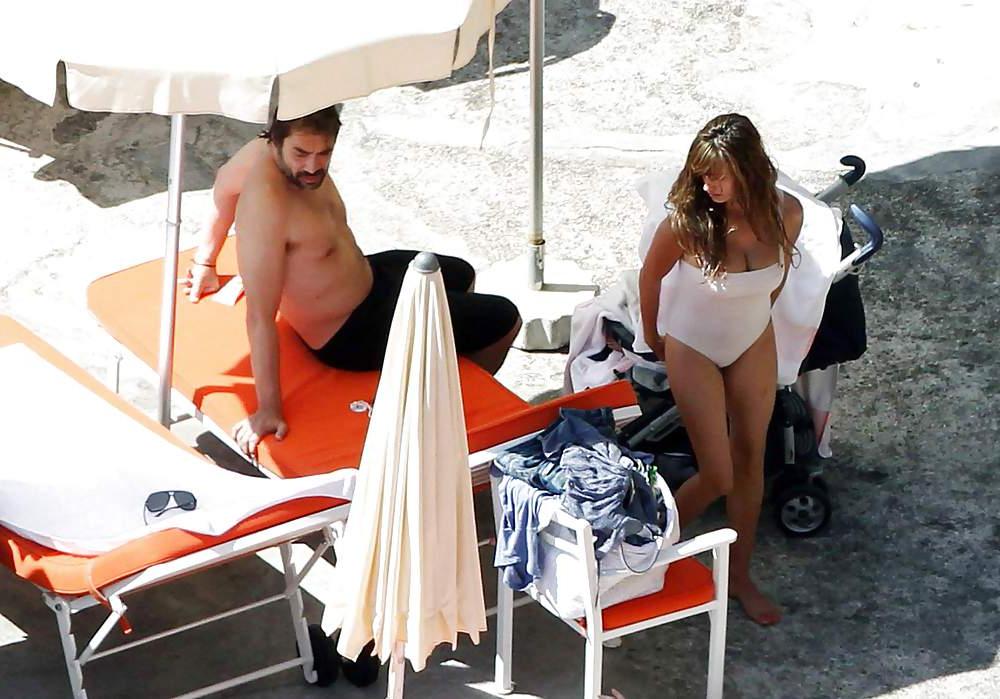 14P Penelope Cruz relaxing by the pool in a swimsuit